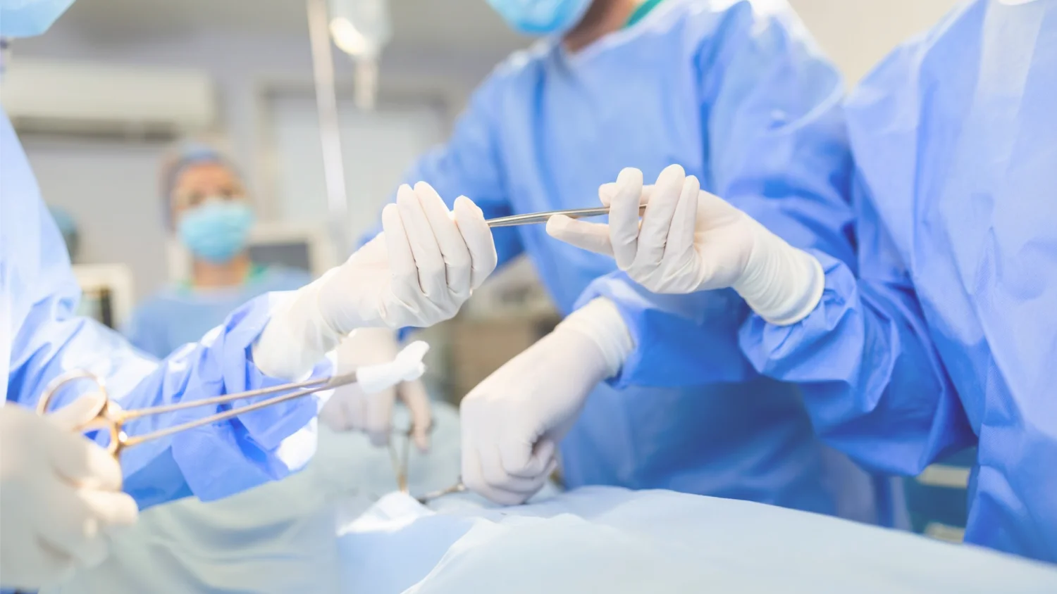 Surgical team in theatre using Amaryllis sterile gowns and drapes